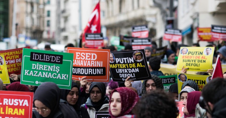 Women in Istanbul hold banners which read murderer Russia, murderer Iran, murderer Esed during the protest on February 29, 2020 after 33 Turkish soldiers were killed in Idlib, Syria on 27 February.