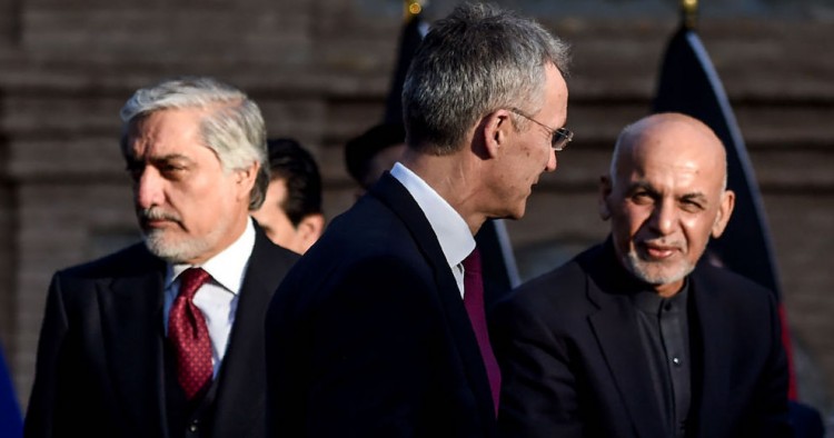 NATO Secretary General Jens Stoltenberg (C) arrives along with Afghanistan's President Ashraf Ghani (R) and Afghan presidential election opposition candidate Abdullah Abdullah ahead of a press conference at the presidential palace in Kabul on February 29, 2020.