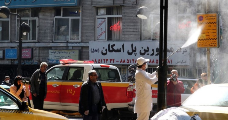 Iranian fire fighters and municipality workers disinfect a street in the capital Tehran for corona virus COVID-19 on March 5, 2020. 