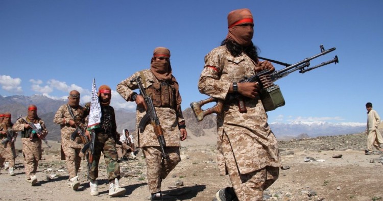 Afghan Taliban fighters and villagers attend a gathering as they celebrate the peace deal signed between US and Taliban in Laghman Province, Alingar district on March 2, 2020. 