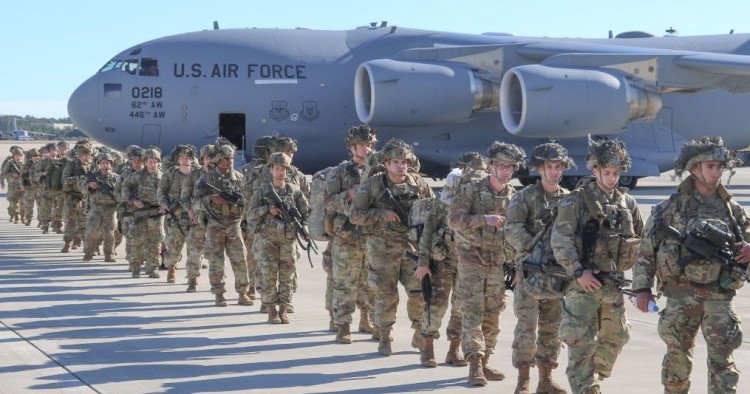U.S. Army Paratroopers assigned to the 2nd Battalion, 504th Parachute Infantry Regiment, 1st Brigade Combat Team, 82nd Airborne Division, deploy from Pope Army Airfield, North Carolina on January 1, 2020. 