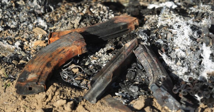 Damaged military gear is scattered on the ground at the site of an Islamic State (IS) group attack, a day earlier, on a unit of Iraq's Hashed al-Shaabi (Popular Mobilisation Forces) in Mukaishefah, about 180km (110 miles) north of the capital, on May 3, 2020. 