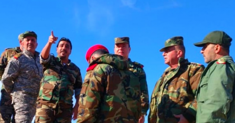 Maj. Gen. Khader (center) tours regime positions near Shoula alongside Feras Jeham (pointing) commander of the Deir ez-Zor NDF and Republican Guard officers.