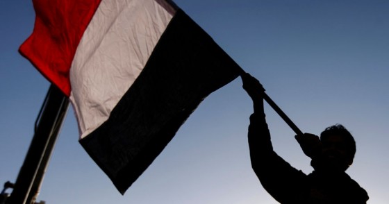 A Yemeni waves a national flag during a rally celebrating the death of Yemeni ex-president Ali Abdullah Saleh a day after he was killed, in the capital Sanaa on December 5, 2017.