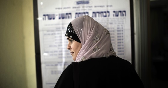 An Arab-Israeli woman waits in line before voting in the northern Israeli village of Maghar January 22, 2013. 