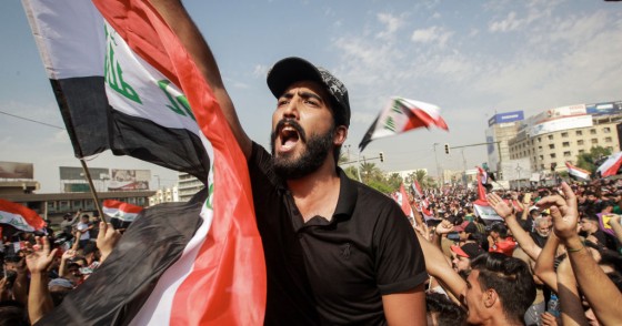 Protesters shout slogans during an anti-government demonstration against the provision of jobs and the alleged government corruption, in Tahrir Square in central Baghdad.