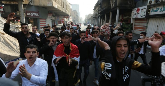 Iraqi protesters chant slogans during a demonstration in Baghdad's al-Rasheed street near al-Ahrar bridge on November 24, 2019.