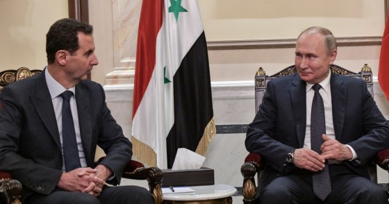 Syria's President Bashar al-Assad (L) and Russia's President Vladimir Putin during a meeting in the Cathedral of Our Lady of the Dormition. 