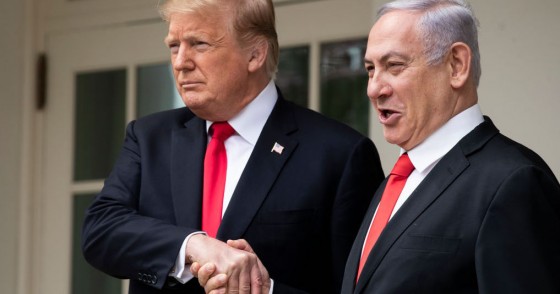 U.S. President Donald Trump and Prime Minister of Israel Benjamin Netanyahu shake hands while walking through the colonnade prior to an Oval Office meeting at the White House March 25, 2019 in Washington, DC.