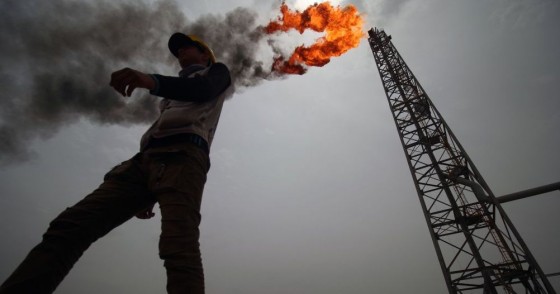 An employee walks at the Hammar Mushrif new Degassing Station Facilities site inside the Zubair oil and gas field, north of the southern Iraqi province of Basra on May 9, 2018. (Photo by HAIDAR MOHAMMED ALI / AFP) (Photo credit should read HAIDAR MOHAMMED ALI/AFP via Getty Images)