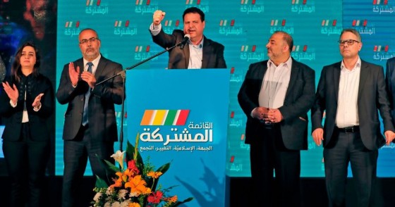 Ayman Odeh (C), leader of the Hadash party that is part of the Joint List alliance, gives an address with other alliance leaders at their electoral headquarters in Israel's northern city of Shefa-Amr on March 2, 2020, after polls officially closed.