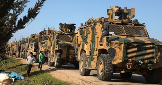 A Turkish military convoy is seen parked near the town of Batabu on the highway linking Idlib to the Syrian Bab al-Hawa border crossing with Turkey, on March 2, 2020.