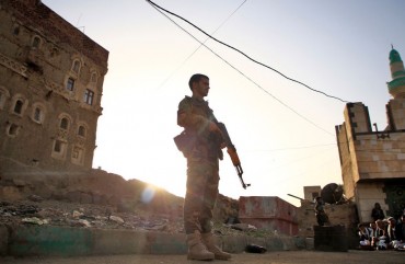 Yemeni security forces loyal to the Huthi-rebel government stands guard as Muslim worshippers perform Eid al-Fitr prayers at a square in the capital Sanaa on June 5, 2019, marking the end of the fasting month of Ramadan.