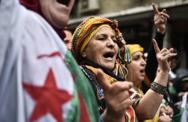 Algerians chant slogans as they take part in an anti-government demonstration in the center of the capital Algiers on January 10, 2020.