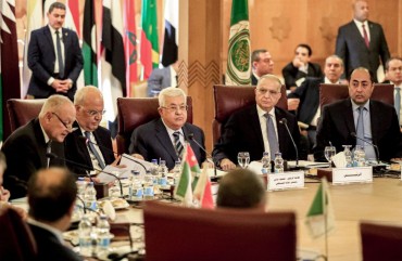 Palestinian president Mahmud Abbas (3rd-L) and Palestine Liberation Organisation (PLO) Secretary-General Saeb Erekat (2nd-L) look on as Arab League Secretary-General Ahmed Aboul Gheit (L) reads a statement during an Arab League emergency meeting discussing the US-brokered proposal for a settlement of the Middle East conflict, at the league headquarters in the Egyptian capital Cairo on February 1, 2020.