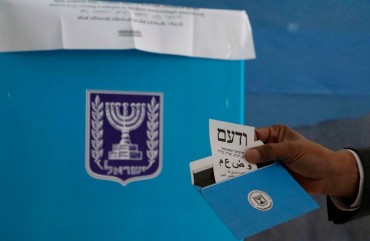 Arab Israeli MP and Arab Joint List candidate Said al-Harumi votes in the Bedouin town of Segev Shalom or Shaqib al-Salam near the southern Israeli city of Beersheva on March 2, 2020. 