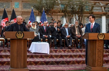 Afghanistan's President Ashraf Ghani (L) speaks as US Secretary of Defense Mark Esper (R) listens during a press conference at the presidential palace in Kabul on February 29, 2020. - The United States signed a landmark deal with the Taliban on February 29, laying out a timetable for a full troop withdrawal from Afghanistan within 14 months as it seeks an exit from its longest-ever war. (Photo by WAKIL KOHSAR / AFP)