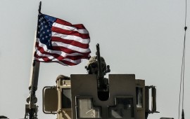 A US military convoy drives on a highway from Kobane to Ain Issa on September 29, 2017.